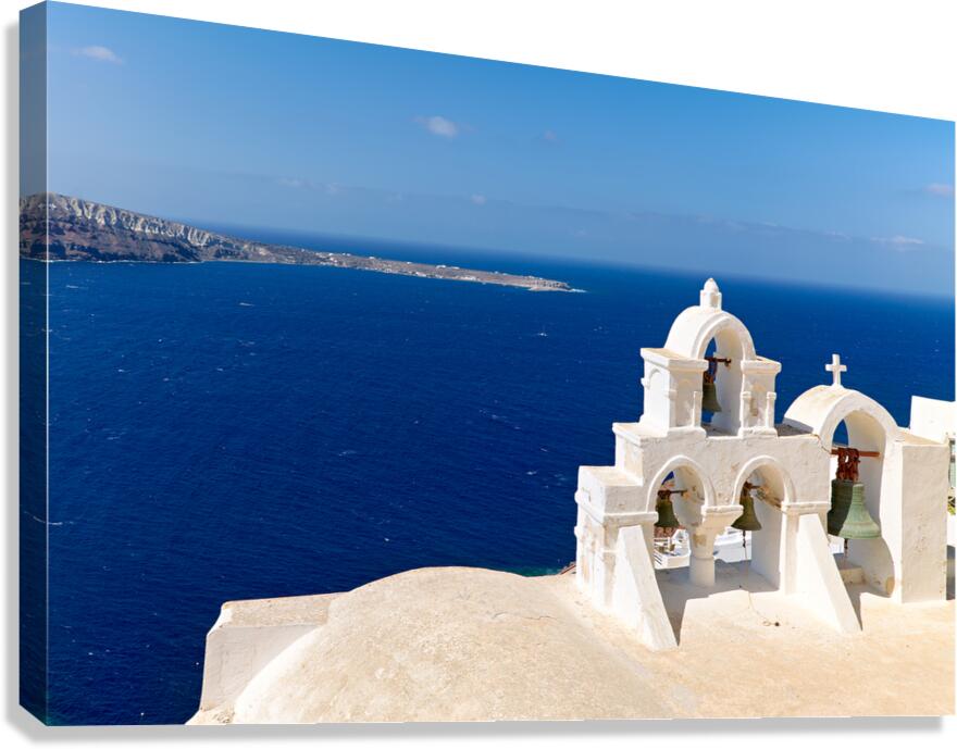 Santorini bell tower with caldera view and deep blue sea.