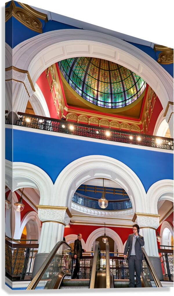 Men ride escalators in Queen Victoria Building in Sydney
