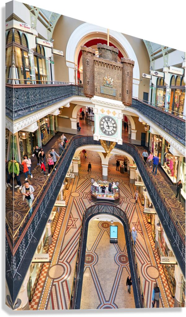 Elegant interior of a multi level shopping arcade with clock.