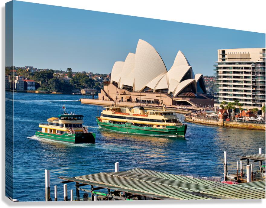Sydney Opera House and ferries on a sunny day.