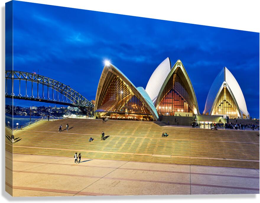 Sydney Opera House and Harbour Bridge at dusk.