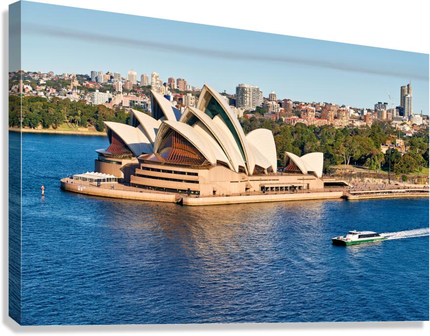 Sydney Opera House and harbor with ferry boat.