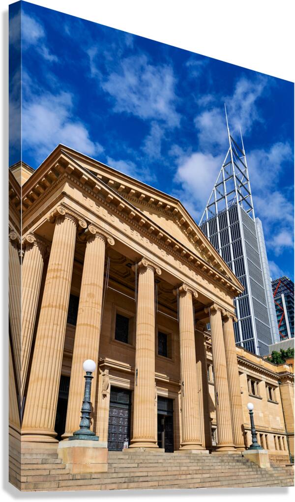 Classical building facade with modern skyscraper behind.