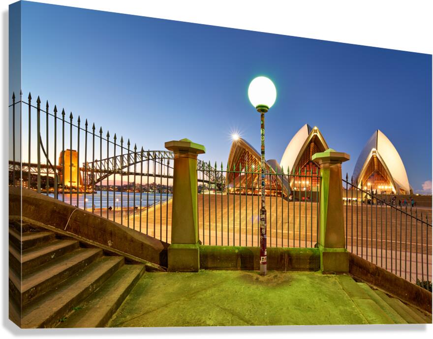 Sydney Opera House and Harbour Bridge at dusk.