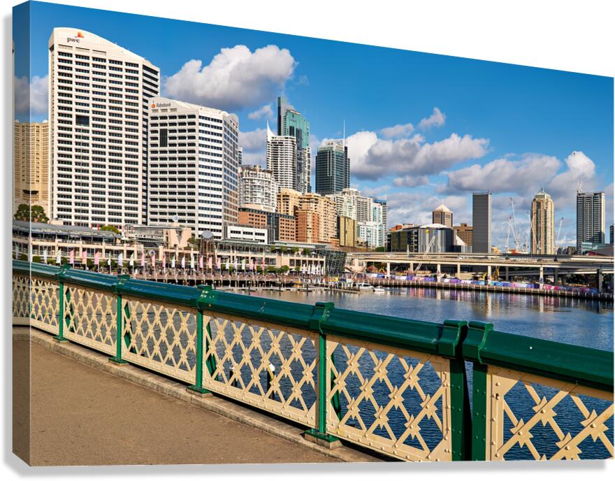 Sydney Harbour skyline with modern buildings and water.