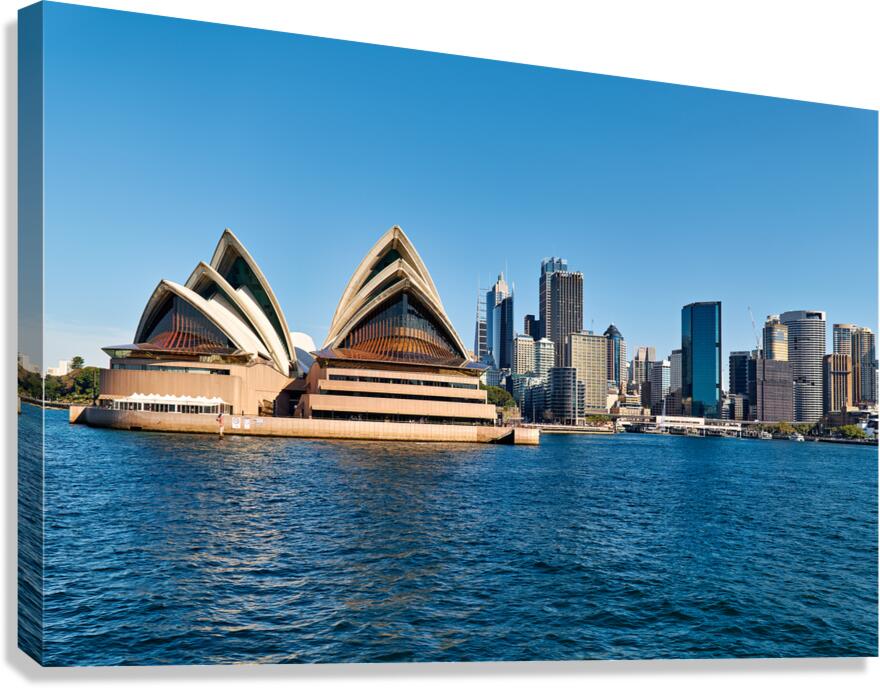 Sydney Opera House and city skyline across the harbor.