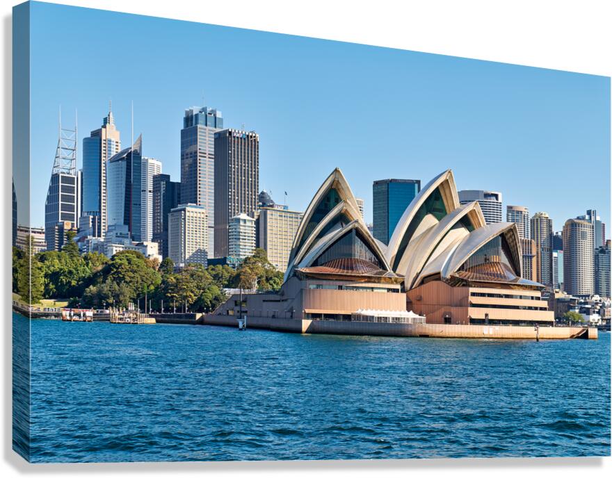 Sydney Opera House and city skyline on a clear day.