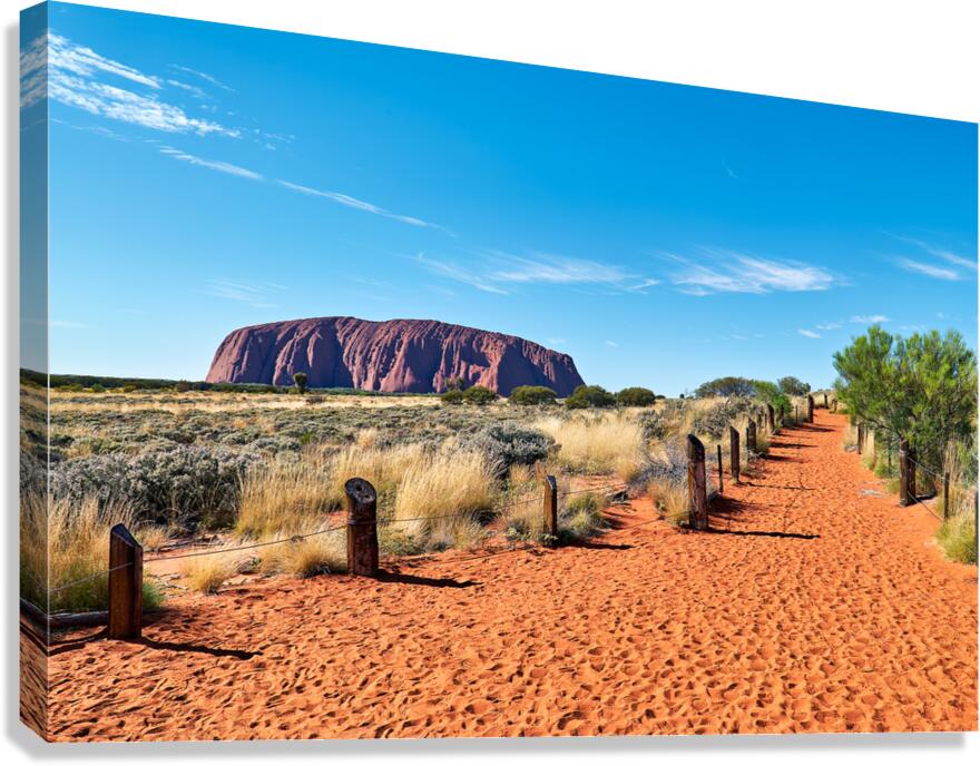 Uluru Australia: A path leads towards the iconic sandstone mono