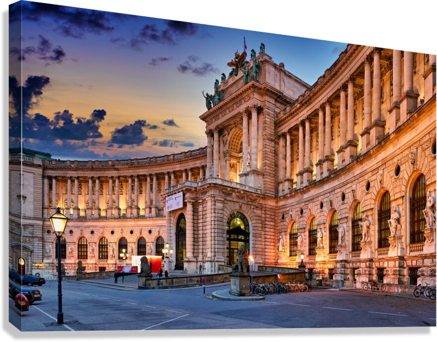 Hofburg Palace Vienna illuminated at dusk.