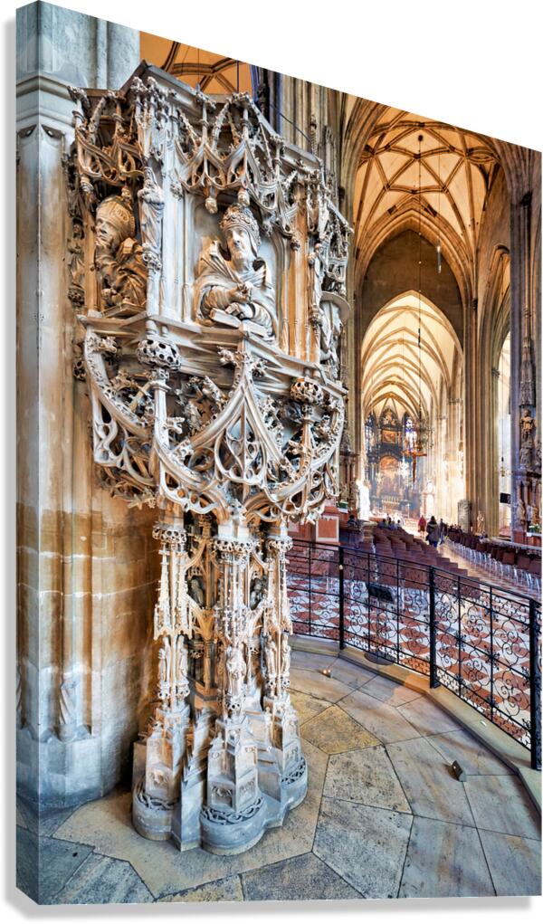 Ornate stone pulpit dominates a grand vaulted cathedral interio