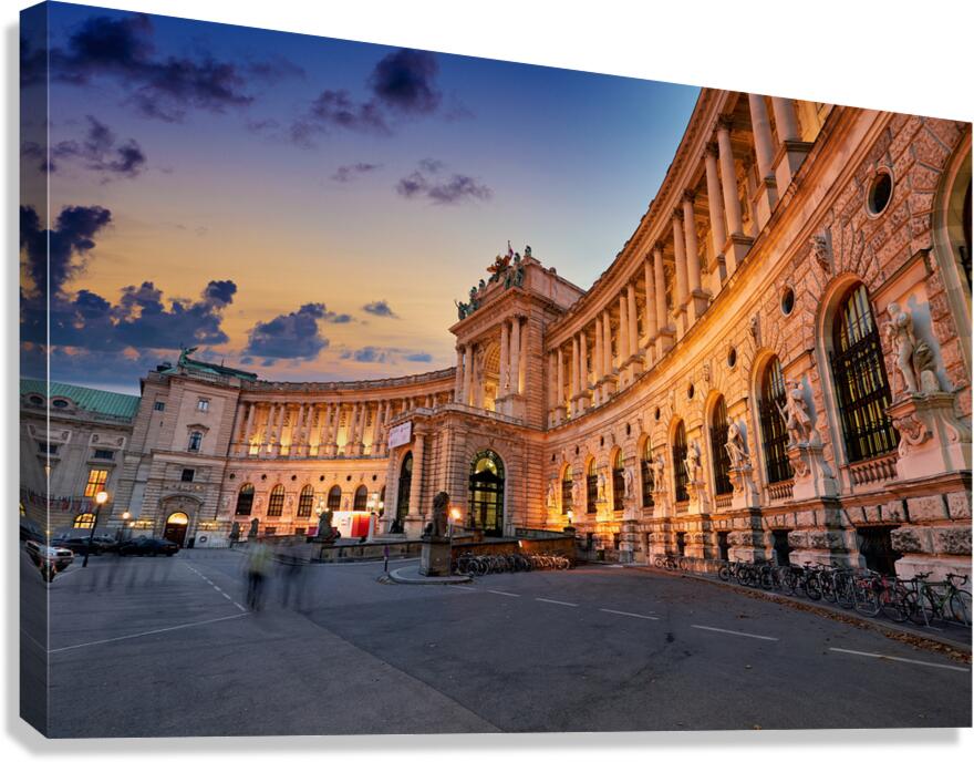 Hofburg Palace Vienna illuminated at dusk.