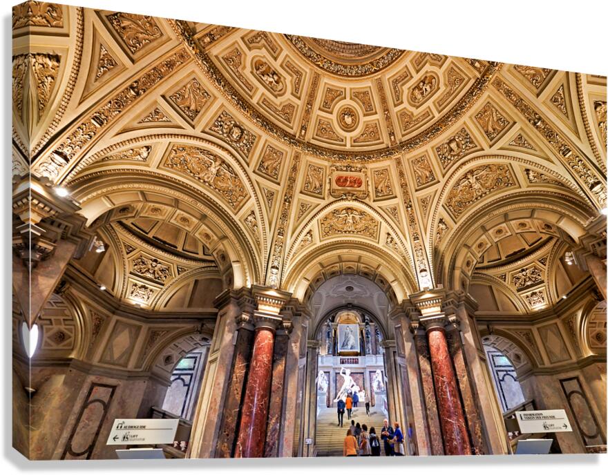Grand ornate museum interior with decorative ceiling and column
