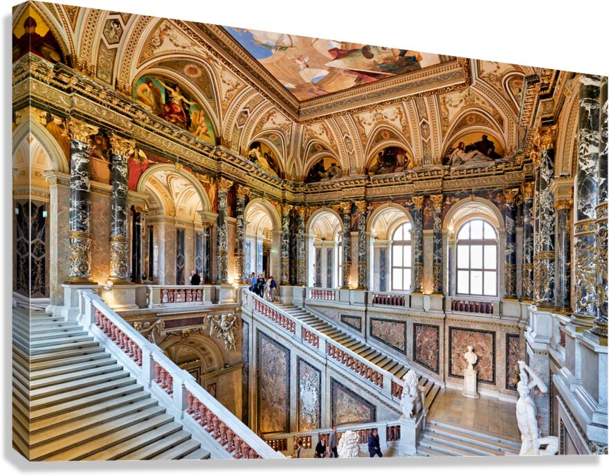 Opulent museum interior featuring grand staircase art and arch