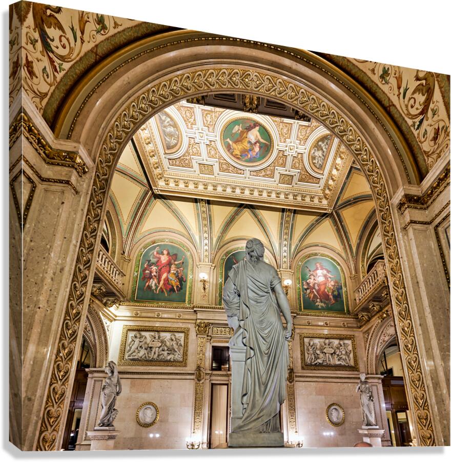 Ornate hall with classical statue and elaborate ceiling art.