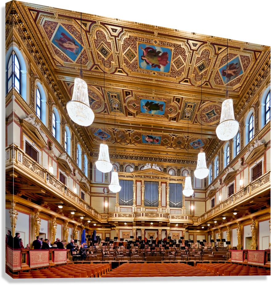 Ornate grand concert hall with organ chandeliers and empty se
