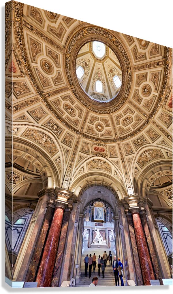 Grand museum interior with ornate dome staircase and classical