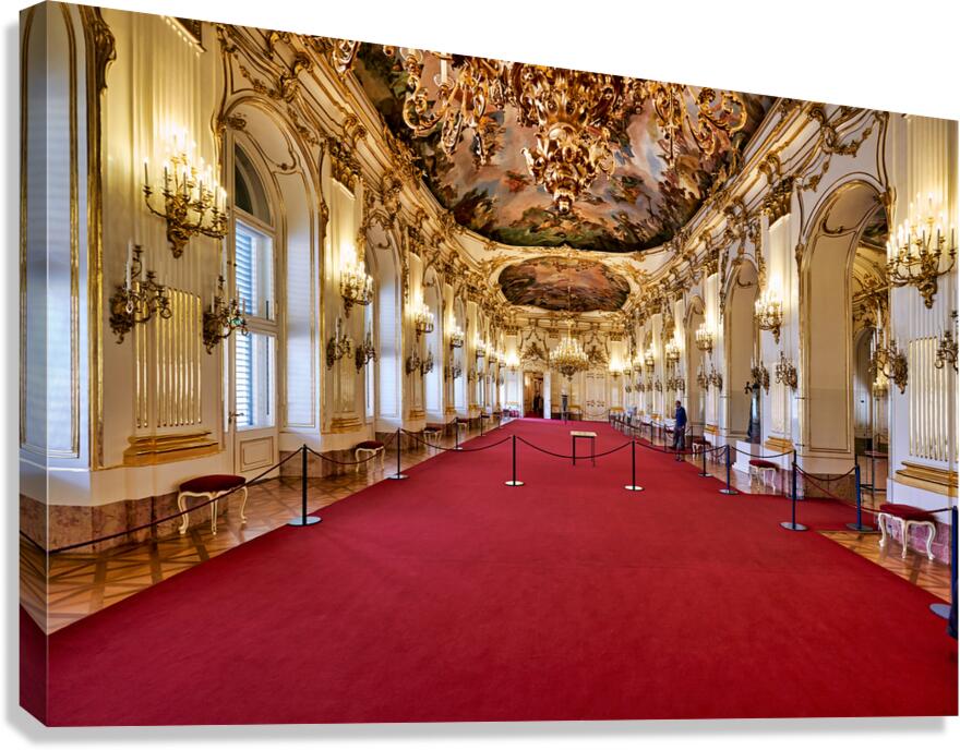Stunning gilded palace hall with red carpet and chandeliers.