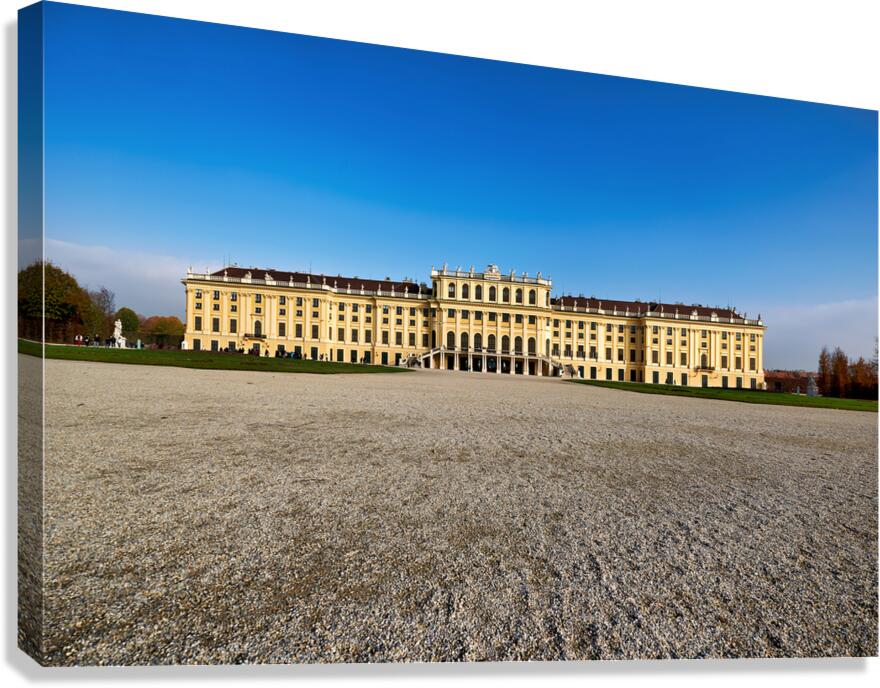 Schönbrunn Palace Vienna Austria under a clear blue sky.
