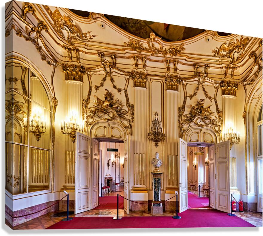 Opulent gold adorned palace room with open doors and red carpet