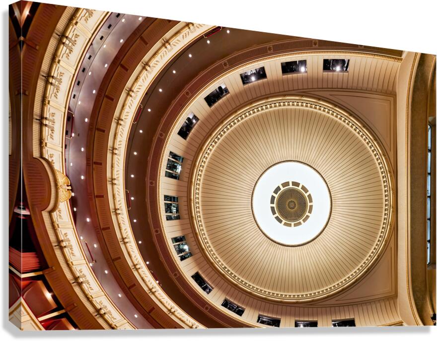 Ornate theater ceiling and balconies viewed from above.