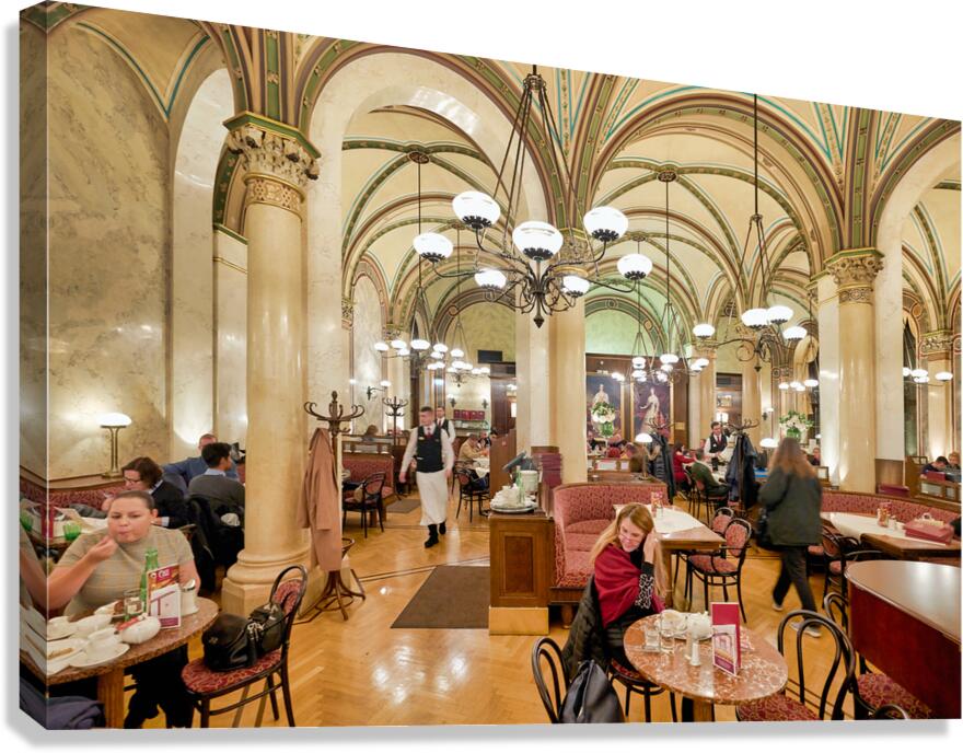 Elegant cafe bustling with customers and waiters.