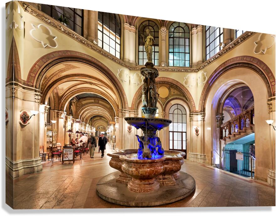 Palais Ferstel interior with fountain arches and people.