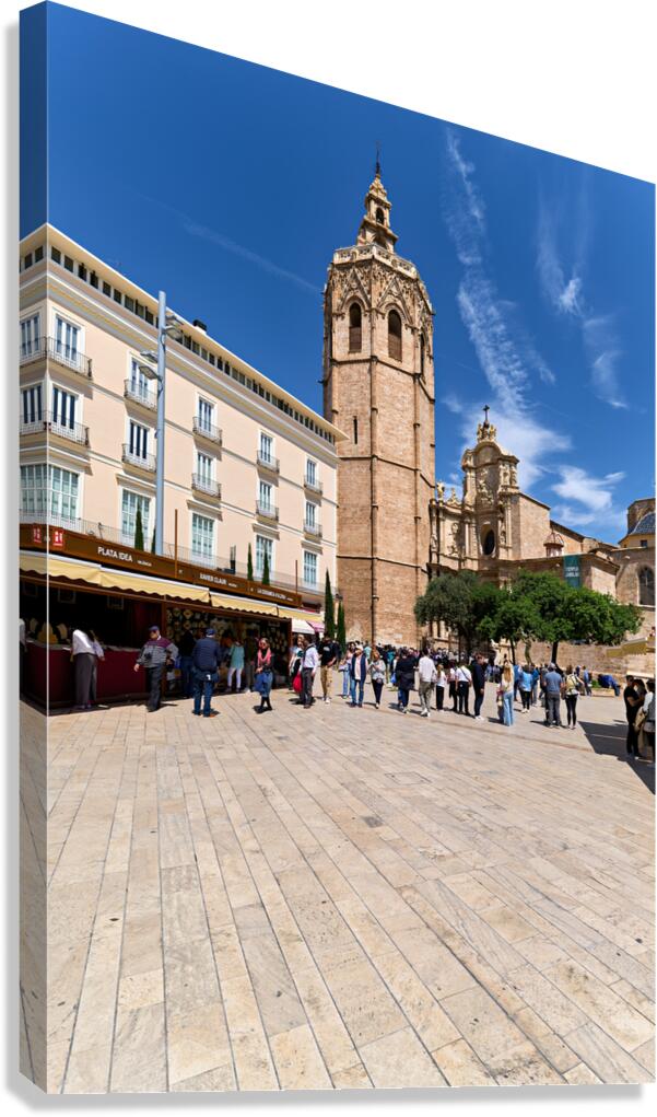 Valencia Cathedral tower stands tall in the plaza with many visi