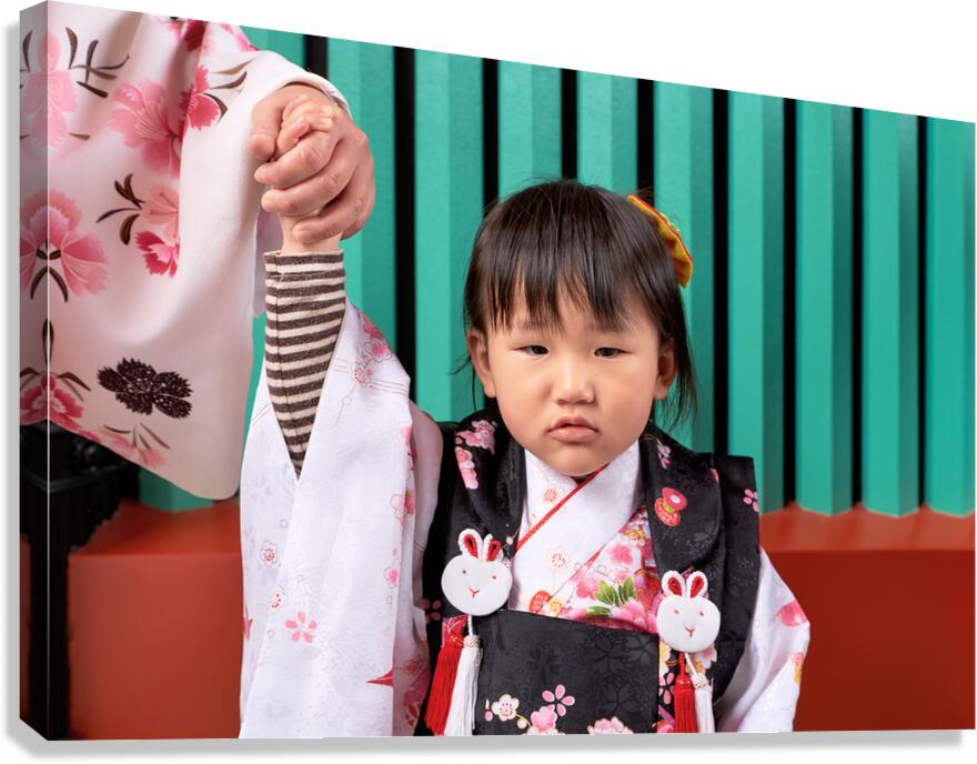 Child in traditional dress in Asakusa Tokyo during a cultural o