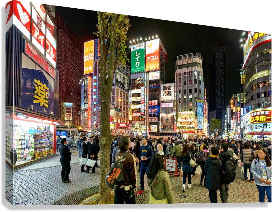 Neon lights bright in Shinjuku district of Tokyo during the nigh