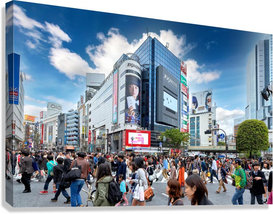 Shibuya Crossing in Tokyo during busy rush hour with many people