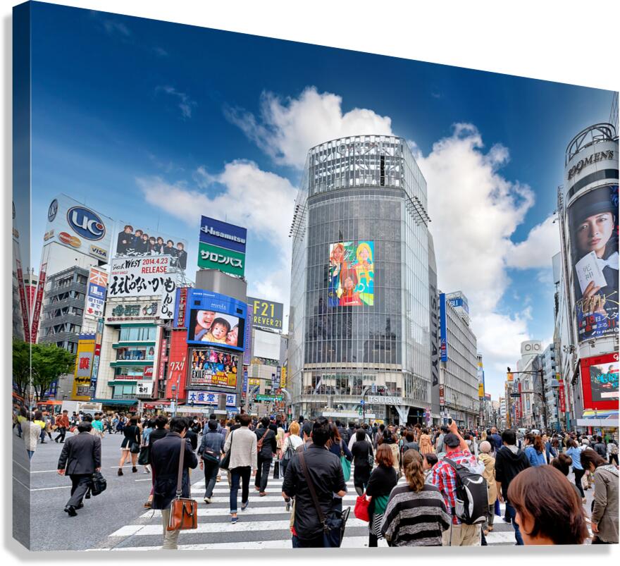 Crowds cross Shibuya Crossing during busy rush hour in Tokyo