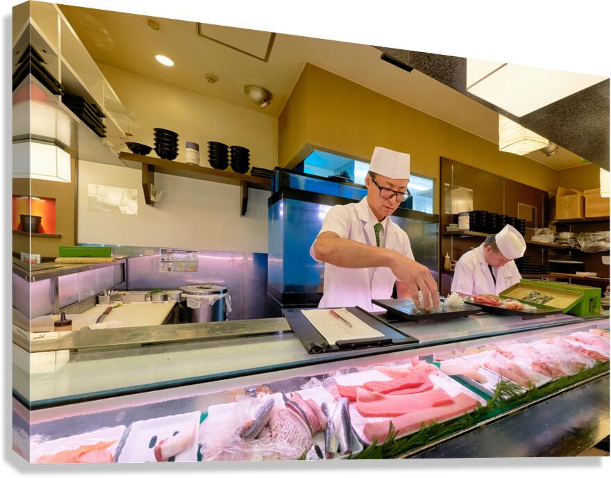 Preparing sushi in a sushi bar in Shibuya Tokyo Japan during t