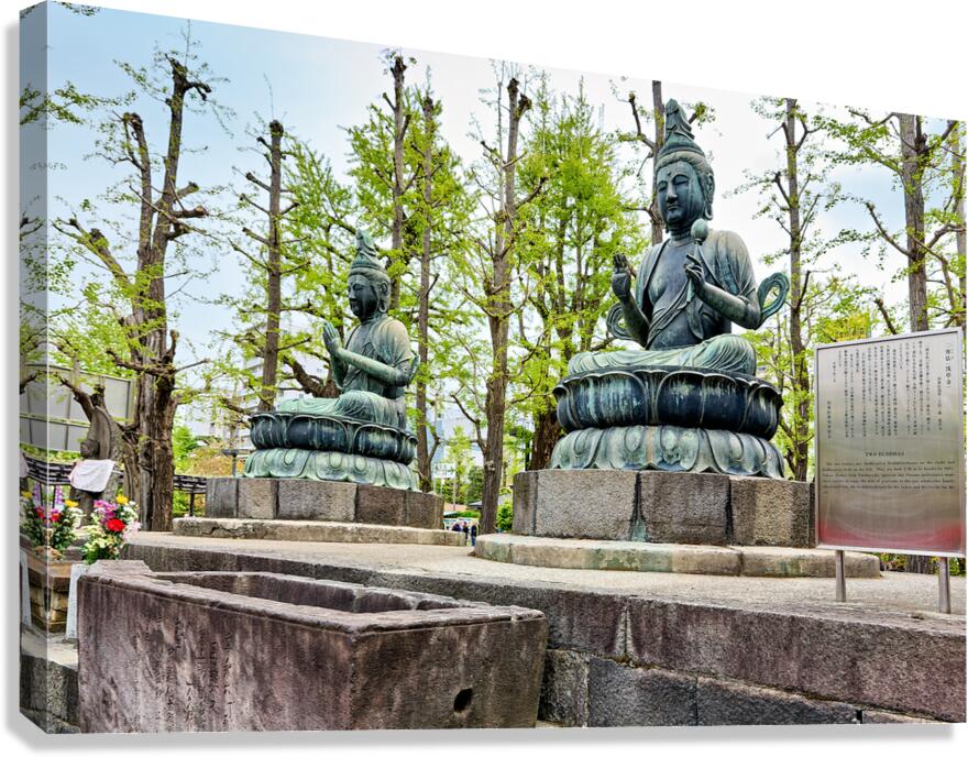 Two bronze Buddha statues at Sensoji Temple in Tokyo Japan