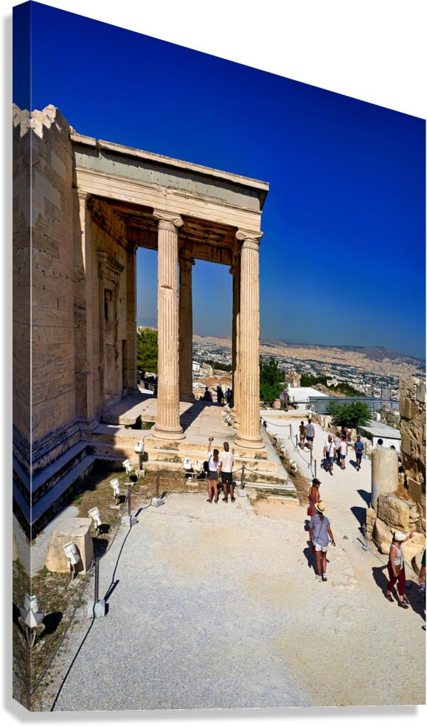 Erechtheion temple in Athens Greece shows visitors and ancient c