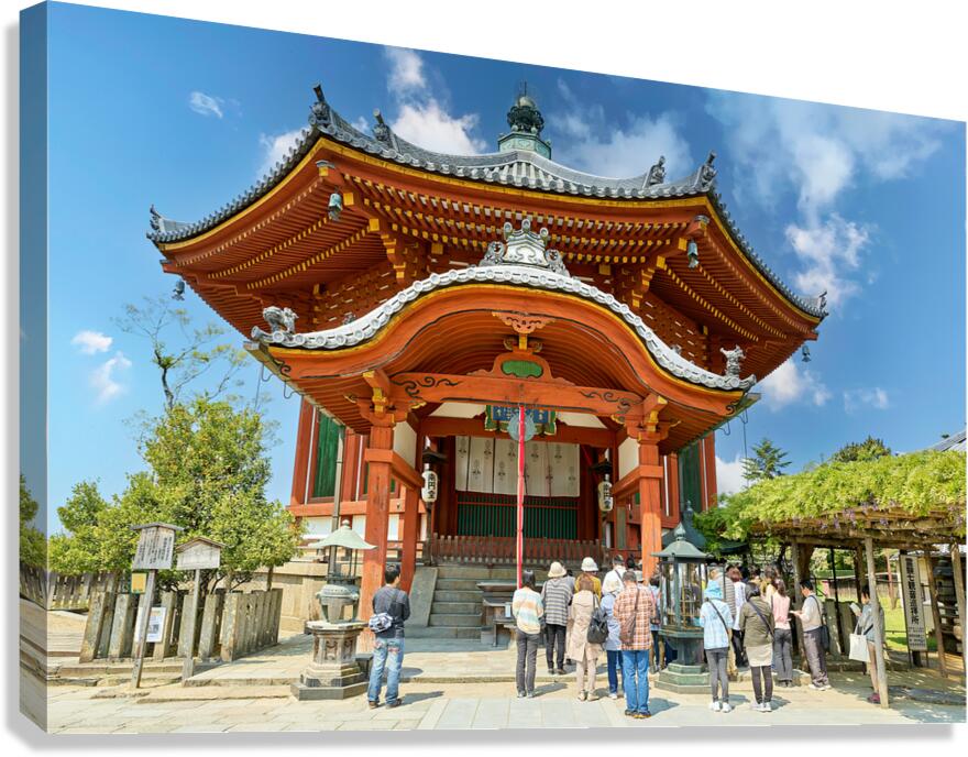 Visitors are praying at a temple in Nara Japan