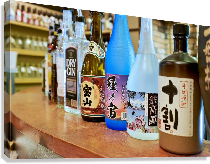 Sake bottles displayed on a counter in Kyoto Japan