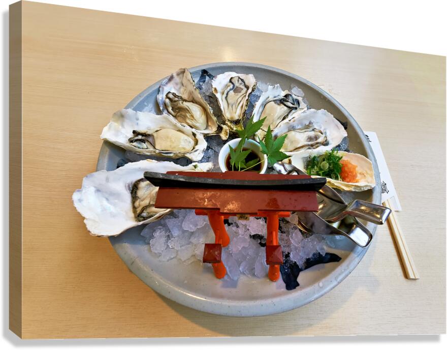 Fresh giant oysters served on a plate in Miyajima Japan