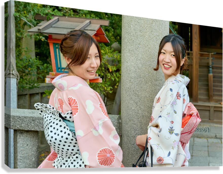Young women in kimono at Yasaka Shrine in Kyoto Japan