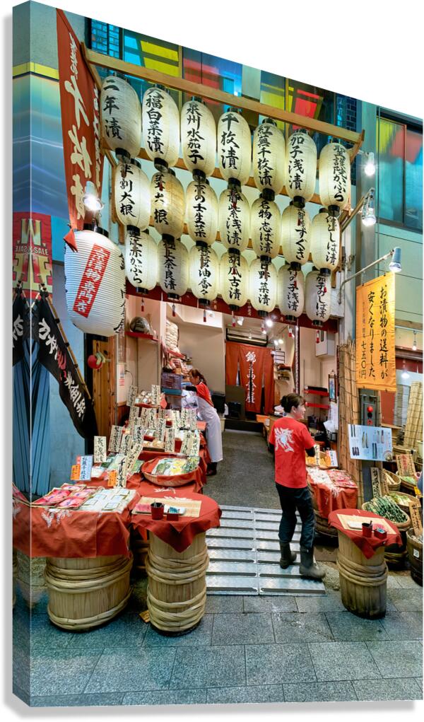 Visitors explore Nishiki Market in Kyoto Japan during the day