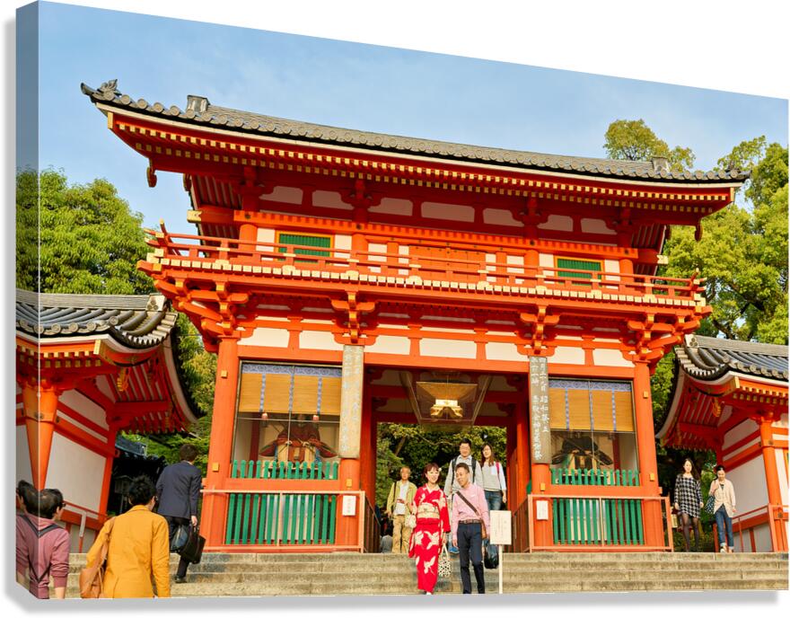 Yasaka shrine temple in Kyoto during a sunny day with visitors