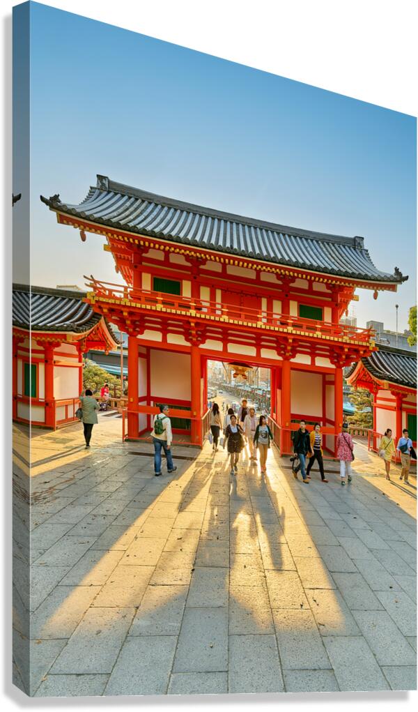 Visitors walk through the main gate of Yasaka shrine temple in K