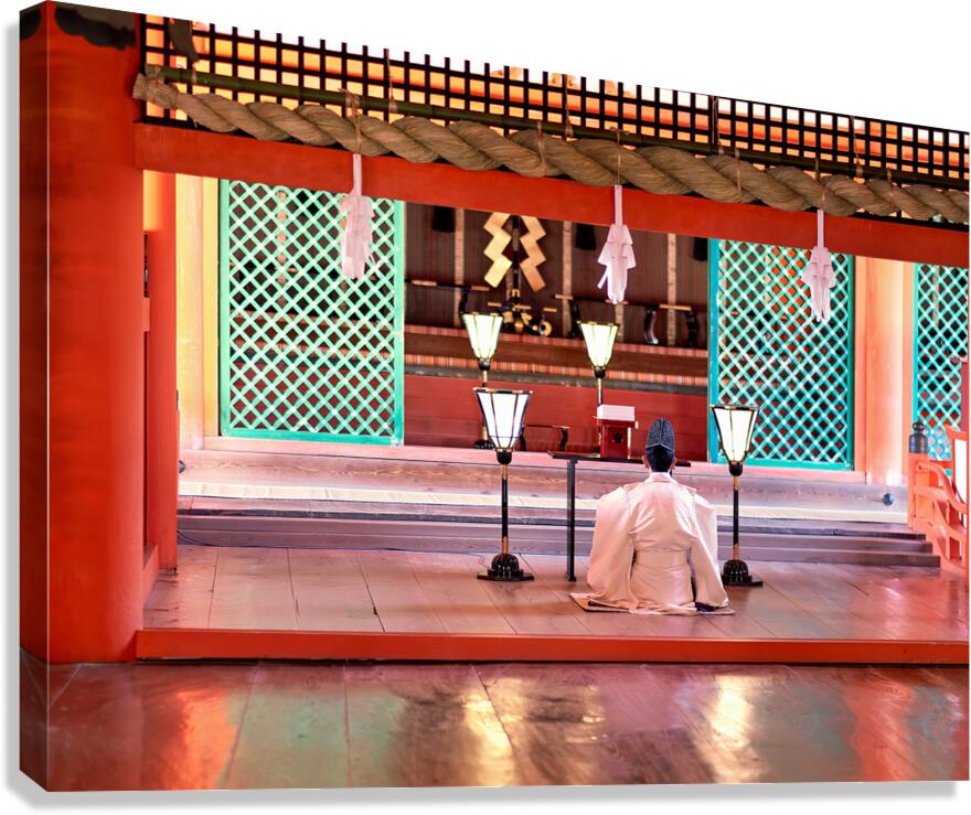 Monk prays in meditation at Itsukushima shrine in Japan