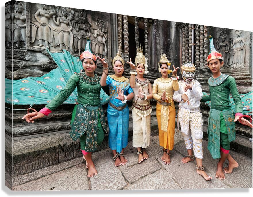Traditional Cambodian dancers in elaborate costumes at ancient t