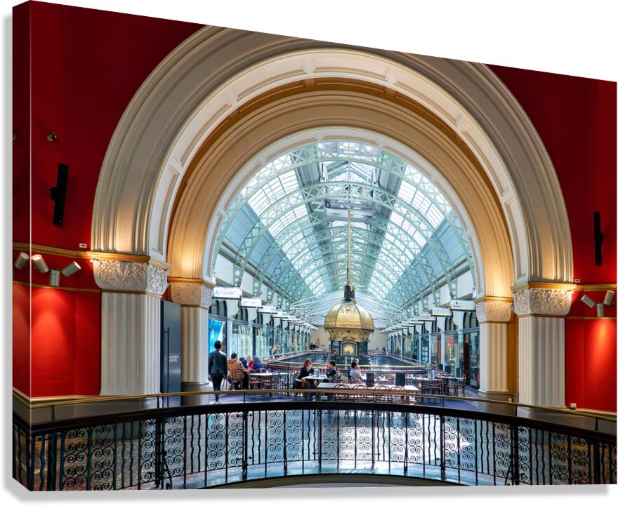 Elegant interior of a shopping arcade with people dining.