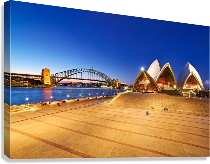 Sydney Opera House and Harbour Bridge at dusk.