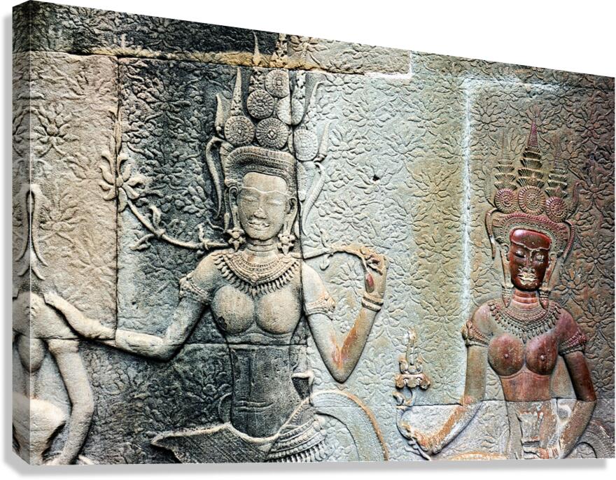 Ancient Khmer temple bas relief carvings of celestial dancers.