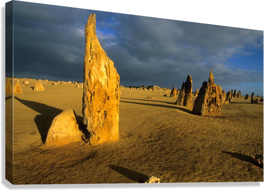 Pinnacles desert landscape at sunset with dramatic clouds.