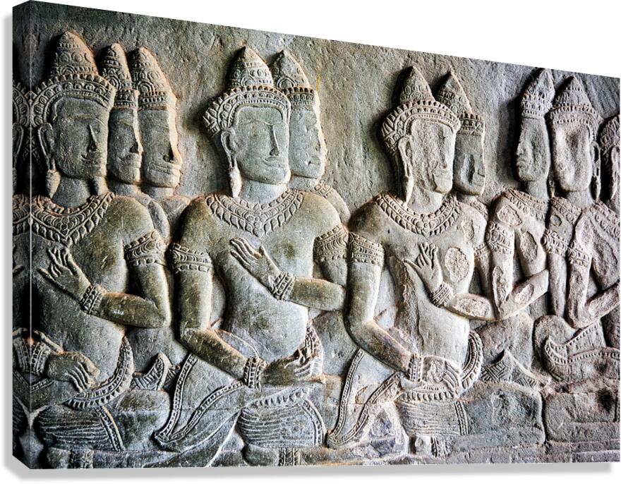 Stone bas relief of Apsara dancers from an ancient temple.