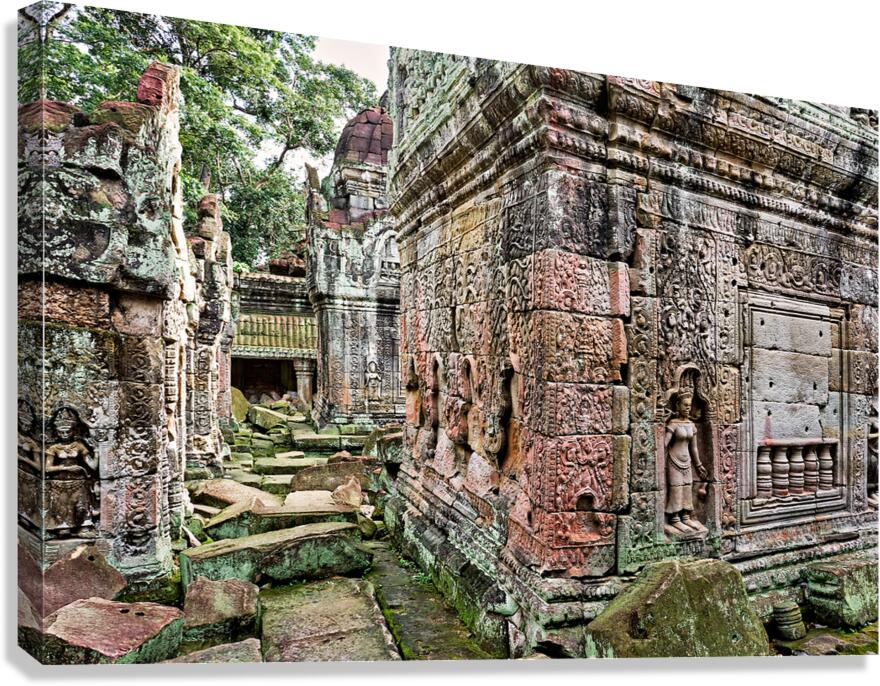 Moss covered ancient temple ruins with detailed carvings and sta