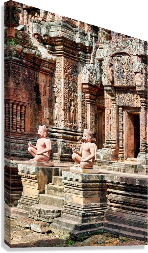 Ancient Cambodian temple with intricate carvings and guardian st